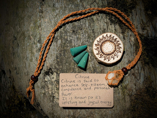 An ethically sourced gift set, containing a Citrine crystal necklace, incense and a handmade pyrography/ woodburning artwork